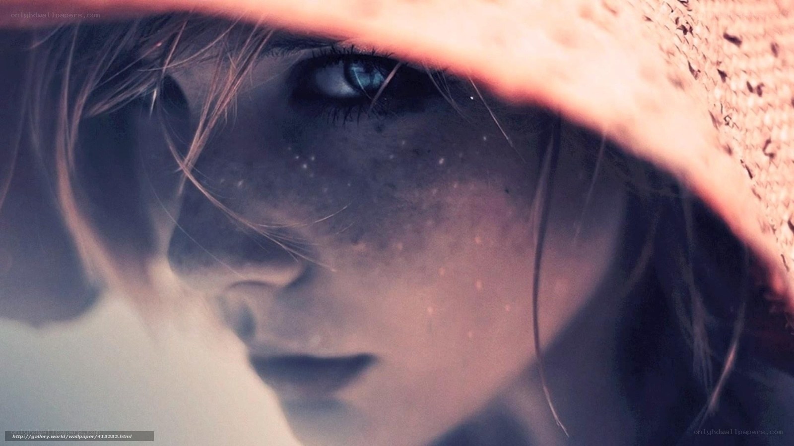 woman with blue eyes under hat