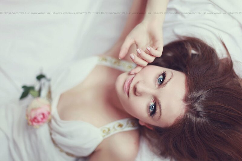 Woman with Blue Eyes — White, Serene, Photograph, Rose