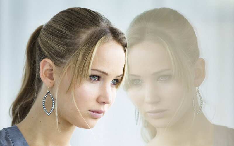 Woman with Blue Eyes — White, Serious, Photograph, Earrings, Ponytail