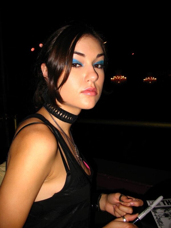 woman with blue eyeshadow at night