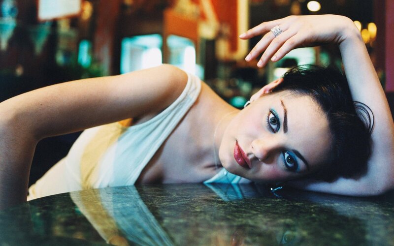 woman with blue eyeshadow resting