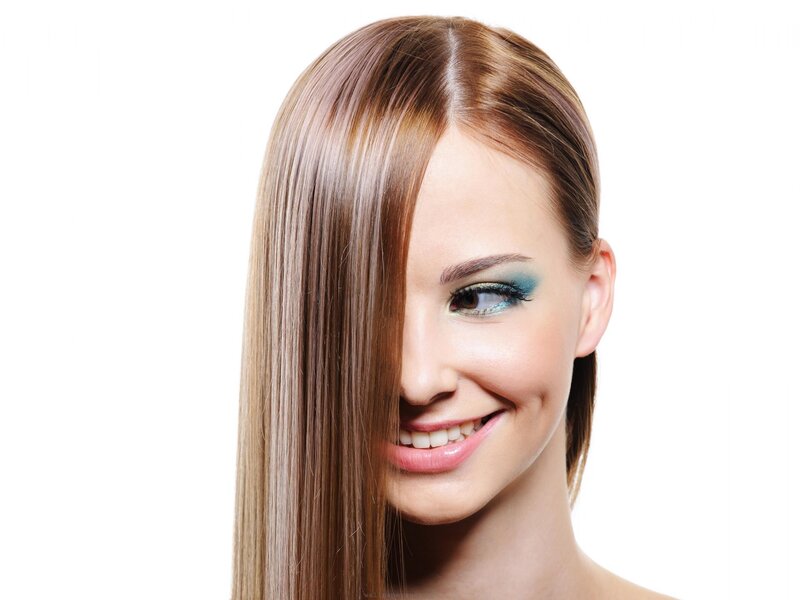 woman with blue eyeshadow smiling