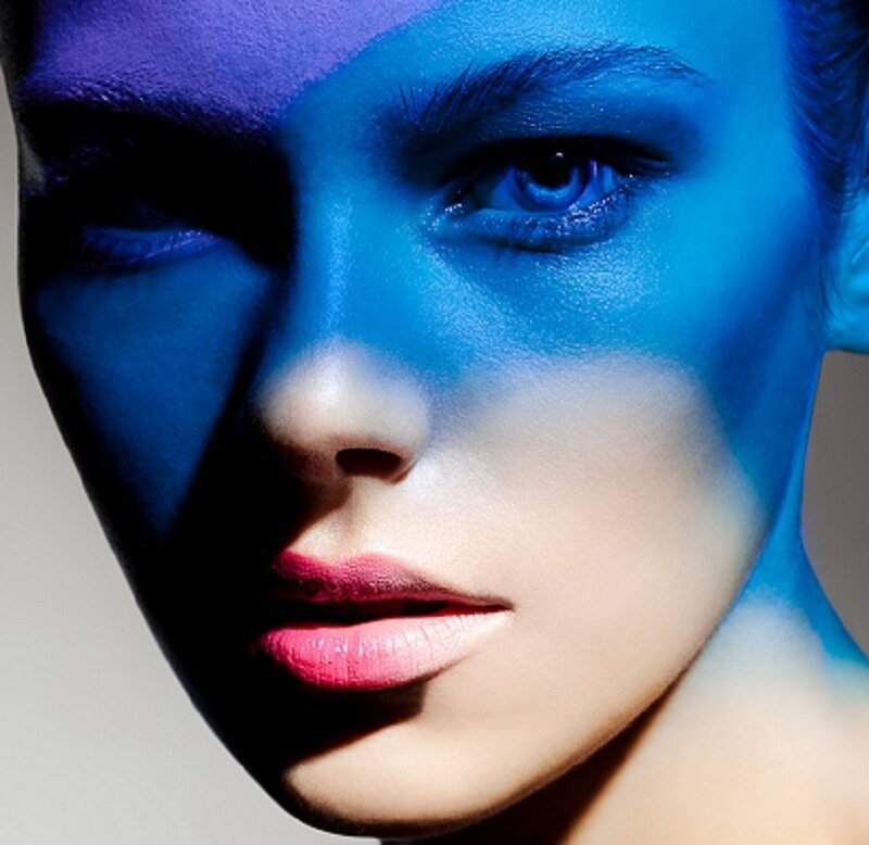 Woman with Blue Face Paint — Dramatic