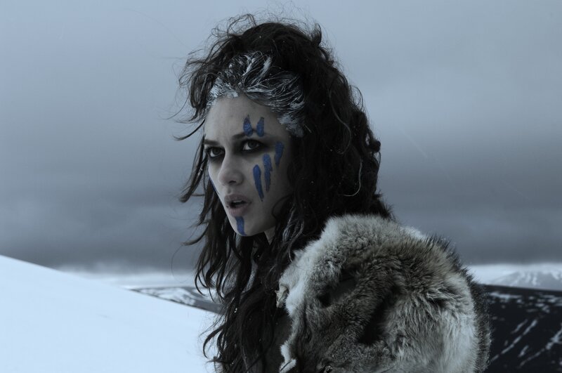 woman with blue face paint in snow