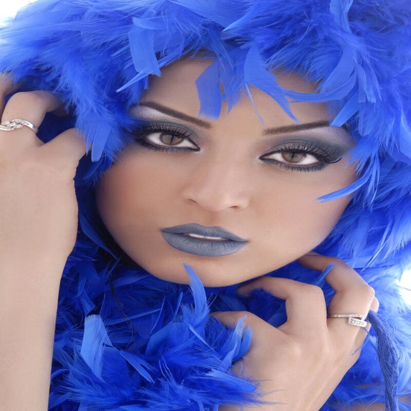 Woman with Blue Feathers — Dramatic