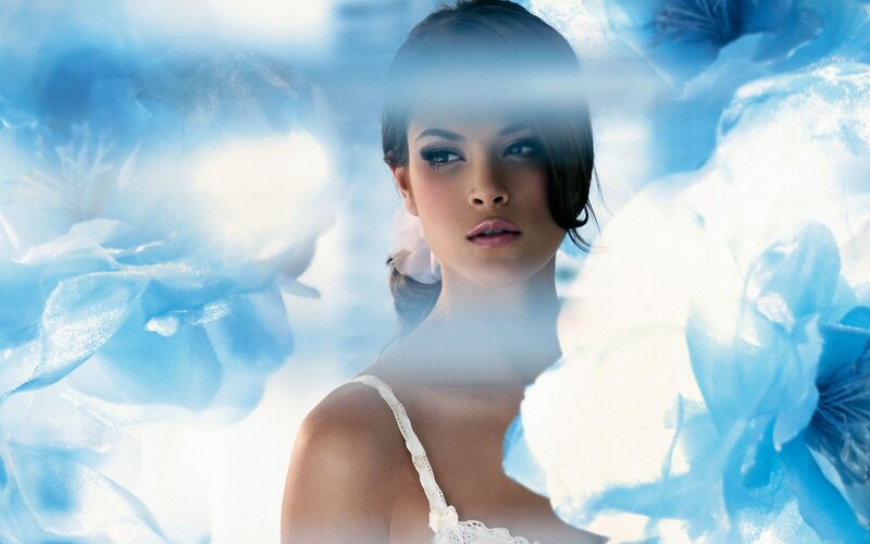 woman with blue floral background