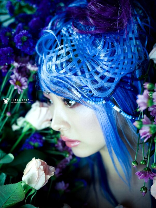 woman with blue hair and flowers