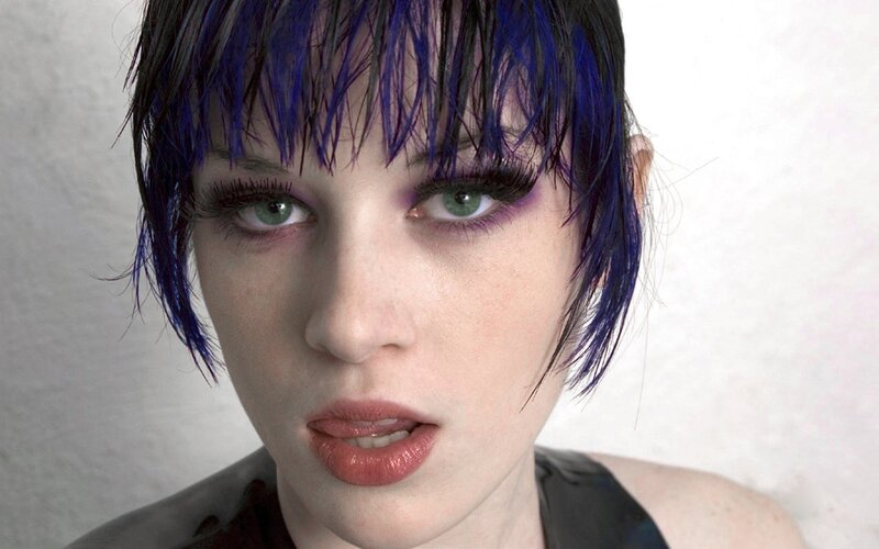 woman with blue hair and green eyes