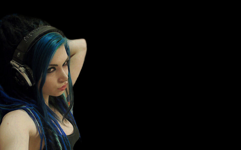 woman with blue hair and headphones