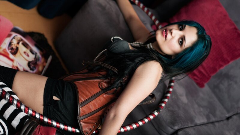 woman with blue hair and hula hoop