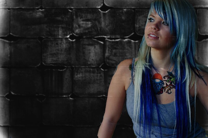 woman with blue hair and tattoos