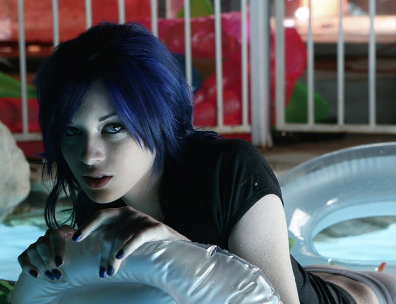 woman with blue hair at pool