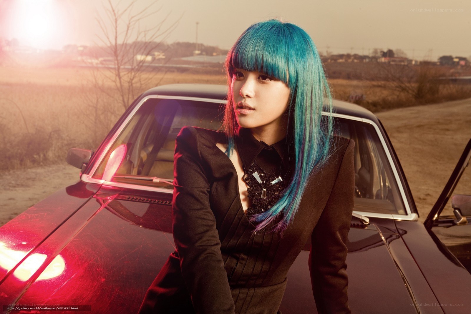 woman with blue hair by car