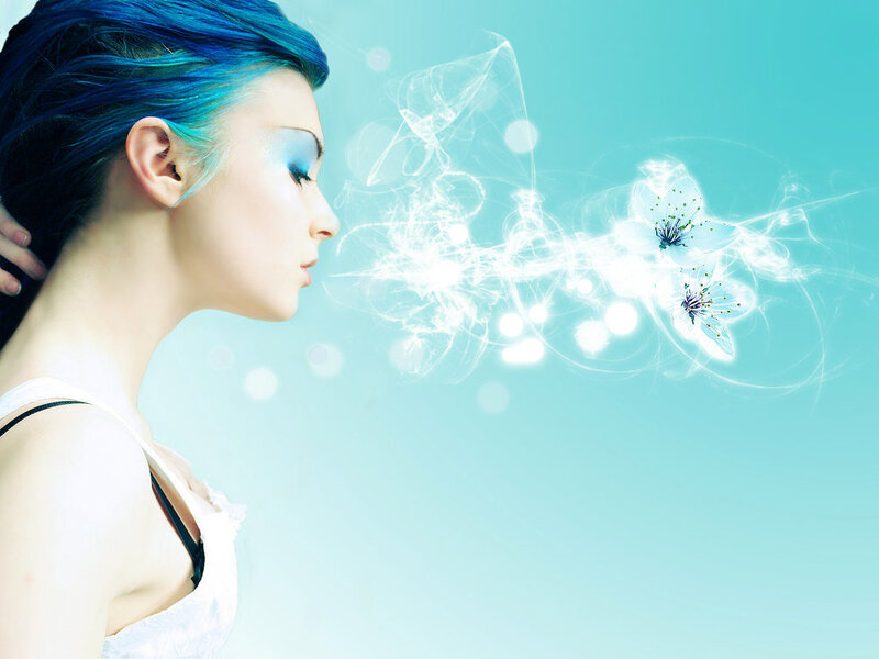 woman with blue hair exhaling flowers