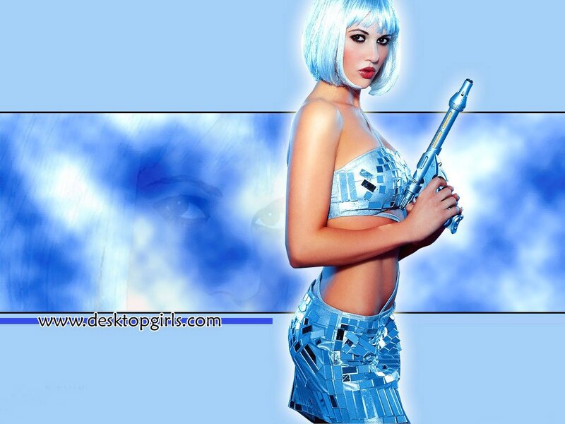 woman with blue hair holding gun