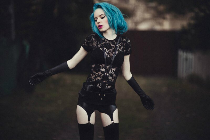 woman with blue hair in black outfit