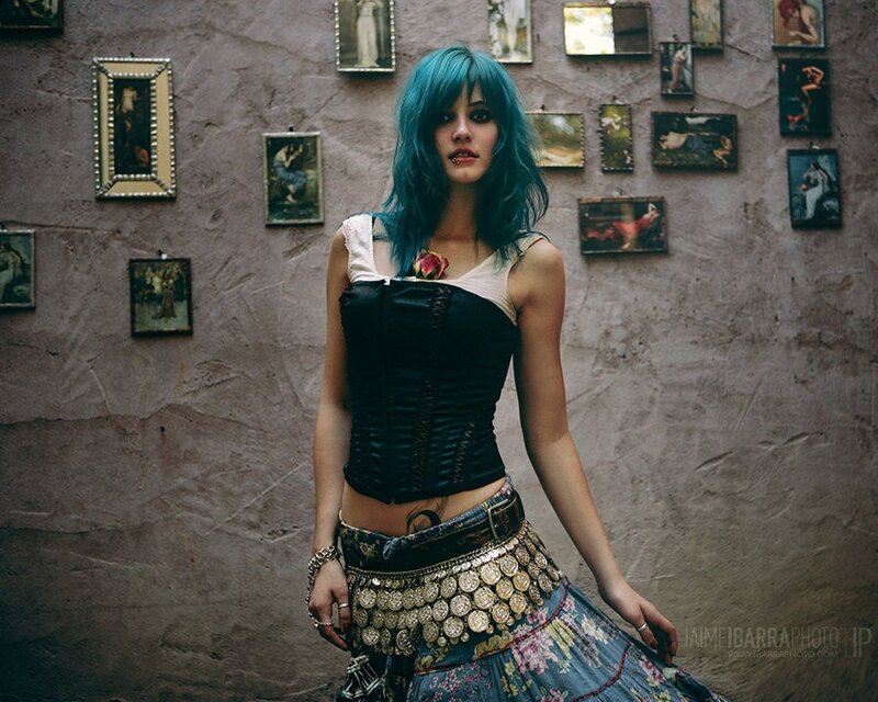woman with blue hair in bohemian outfit