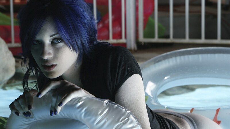 woman with blue hair in pool