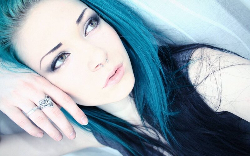 woman with blue hair lying down