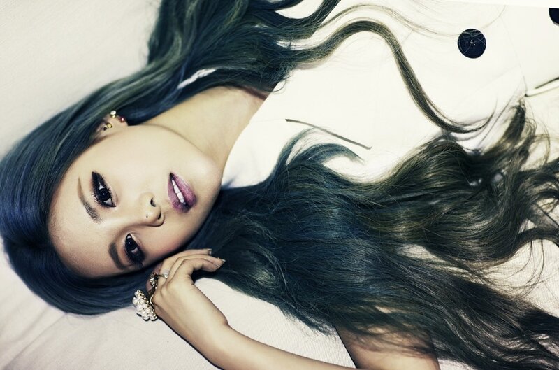 woman with blue hair lying down
