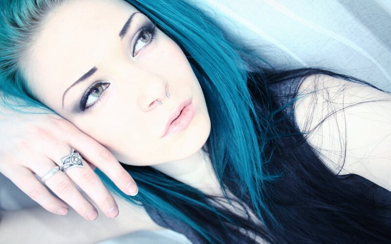 woman with blue hair lying down