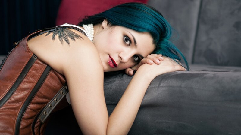 woman with blue hair resting