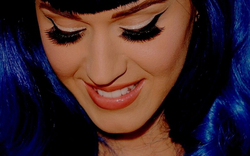 woman with blue hair smiling