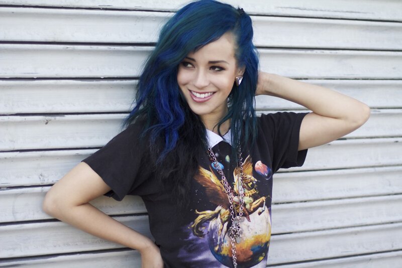 woman with blue hair smiling