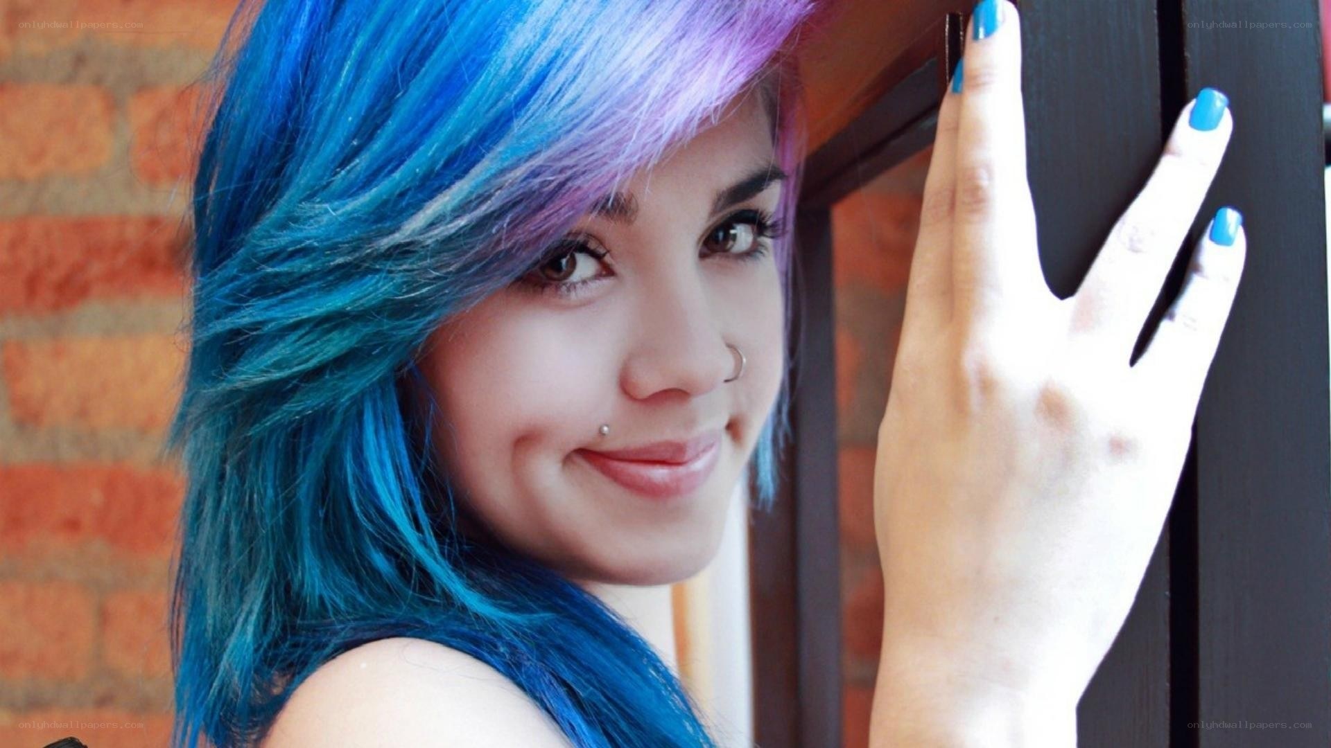 woman with blue hair smiling