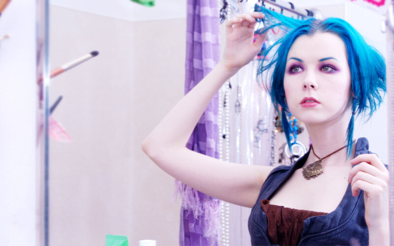 woman with blue hair styling