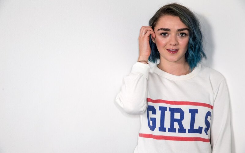 woman with blue hair wearing girls sweatshirt