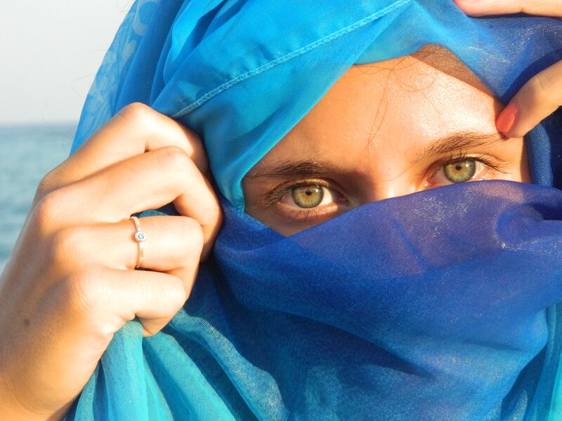 woman with blue headscarf