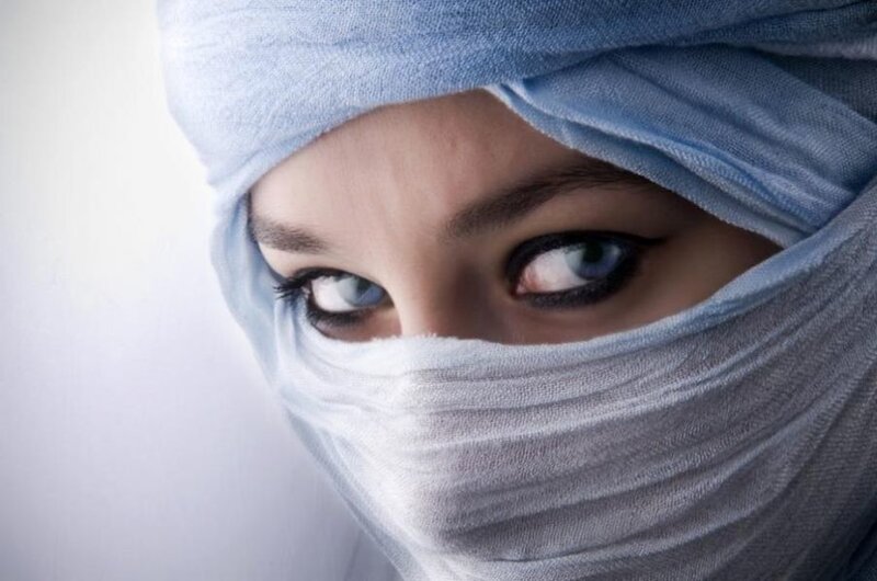 woman with blue headscarf