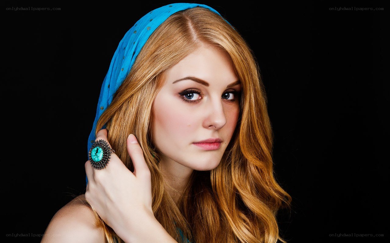 woman with blue headscarf and ring
