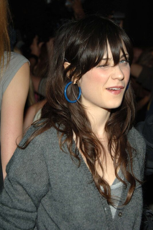 woman with blue hoop earrings