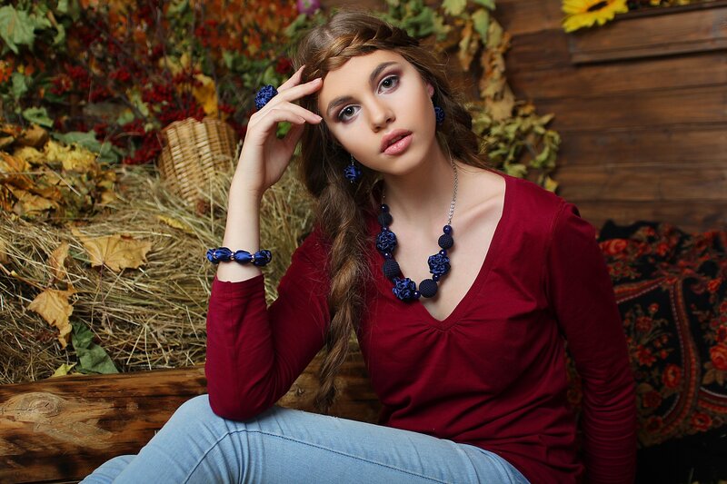Woman with Blue Jewelry — Red