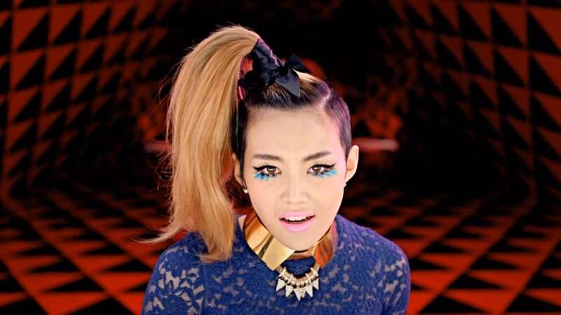 woman with blue makeup and high ponytail