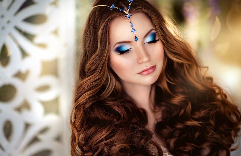 Woman with Blue Makeup — Brown, Serene