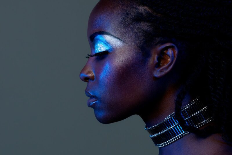 woman with blue makeup in profile