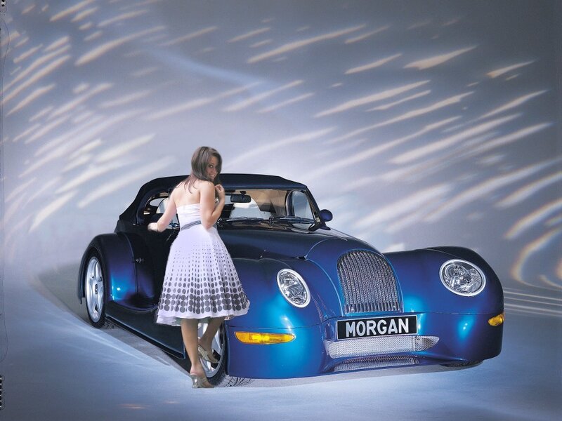 Woman with blue Morgan car