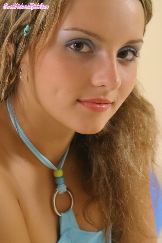 woman with blue necklace