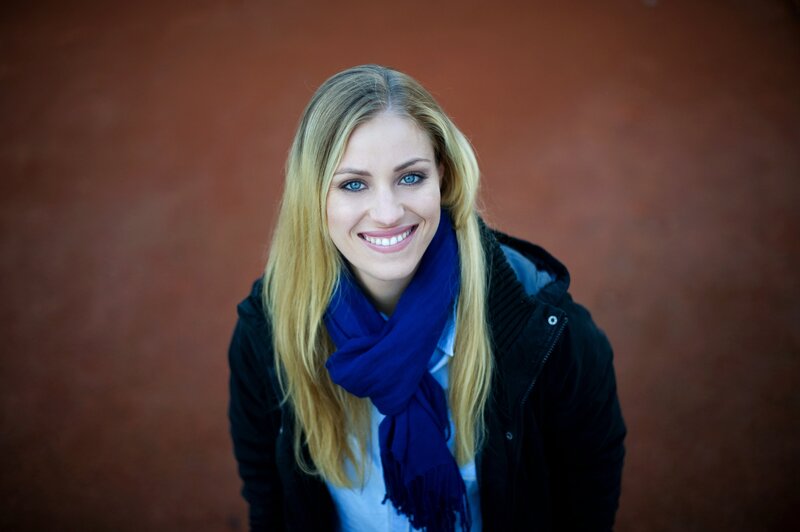 woman with blue scarf smiling