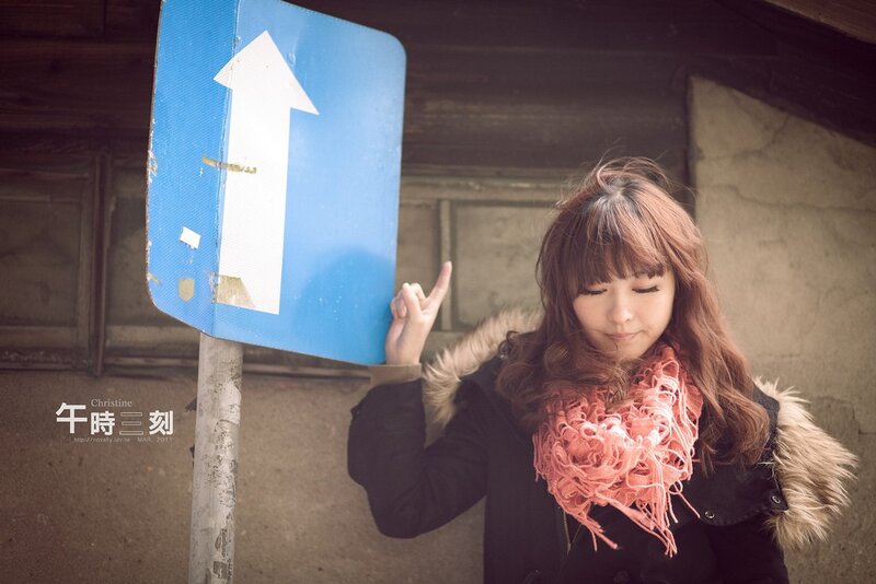 Woman with blue sign