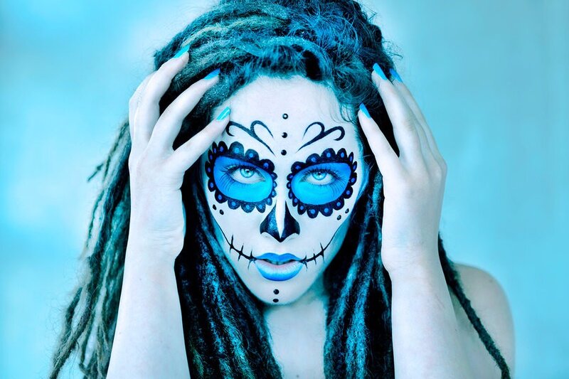 woman with blue sugar skull makeup