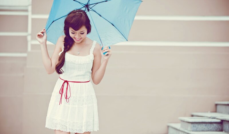woman with blue umbrella