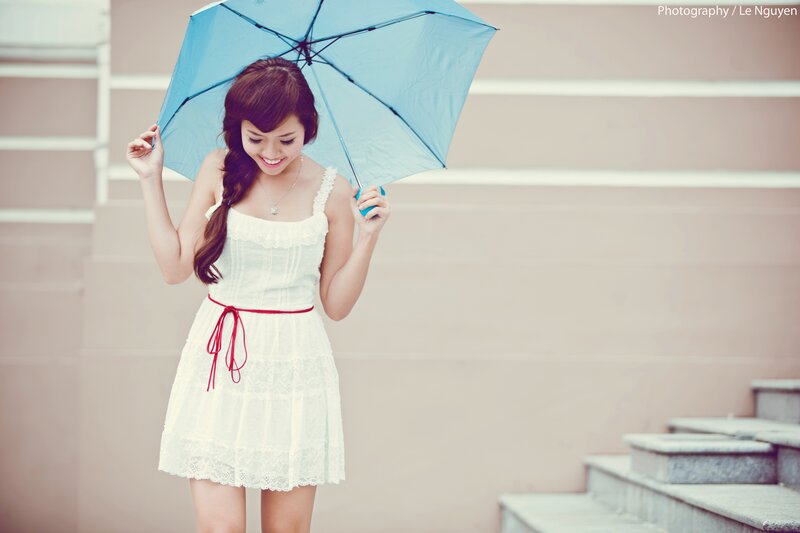 Woman with blue umbrella