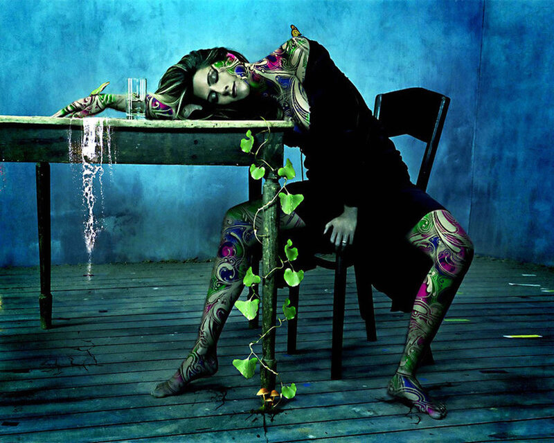 woman with body paint at table