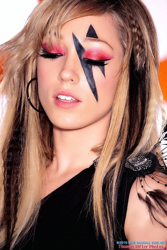 woman with bold makeup and braids