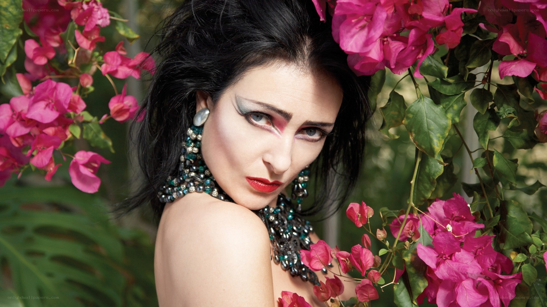 woman with bold makeup and flowers