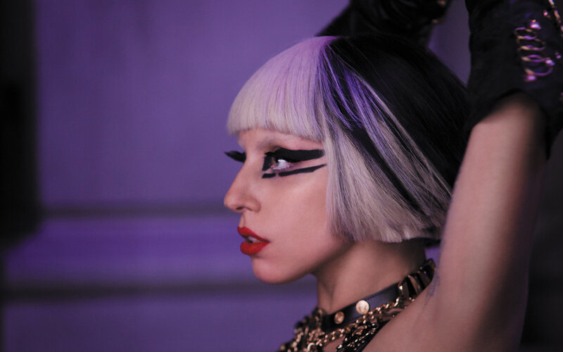 woman with bold makeup and hair